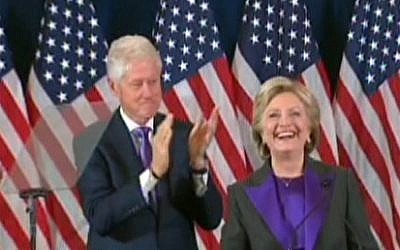 Hillary Clinton, with husband Bill Clinton, giving a concession speech in New York on November 9, 2016. (screen capture: CNN)