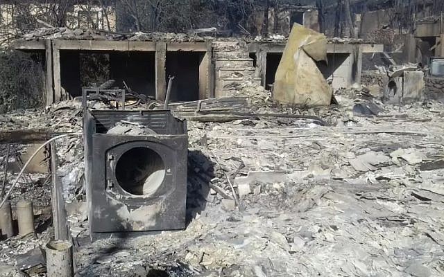 The remains of property in the West Bank settlement of Halamish on November 26, 2016, a day after a devastating fire damaged or destroyed dozens of homes (Israel Fire and Rescue Services) The remains of property in the West Bank settlement of Halamish on November 26, 2016, a day after a devastating fire damaged or destroyed dozens of homes (Israel Fire and Rescue Services)