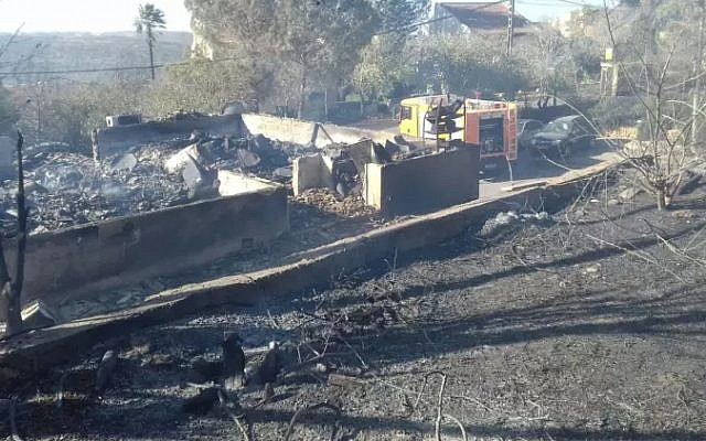 Burned houses in the West Bank settlement of Halamish on November 26, 2016, a day after a devastating fire damaged or destroyed dozens of homes (Israel Fire and Rescue Services) Burned houses in the West Bank settlement of Halamish on November 26, 2016, a day after a devastating fire damaged or destroyed dozens of homes (Israel Fire and Rescue Services)