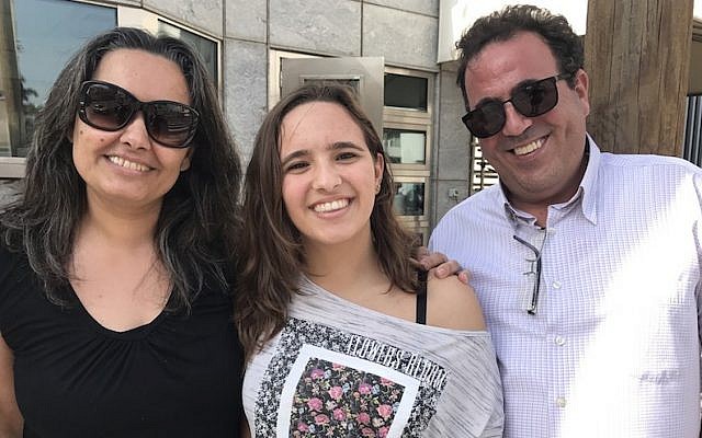 Karen Kadosh leaving the US Embassy in Tel Aviv with her parents, Nov. 14, 2016. (Andrew Tobin/JTA) 