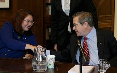 Illinois Senate seat rivals Tammy Duckworth and Mark Kirk shaking hands following their debate at the Chicago Tribune, Oct. 3, 3016. (Nancy Stone/Chicago Tribune/TNS via Getty Images/via JTA)