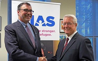 HIAS President and CEO Mark Hetfield (L) and Bishop Dean M. Davies, first counselor in the Presiding Bishopric of the Church of Jesus Christ of Latter-day Saints (R), October 31, 2016. (courtesy HIAS/Rachel Nusbaum)