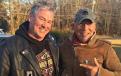 A picture of rocker Bruce Springsteen and biker Dan Barkalow taken November 12, 2016 after the singer got stuck on the side of a New Jersey highway when his motorcycle broke down. (Facebook screen capture)