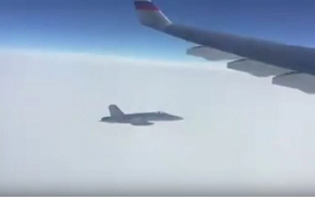 A Swiss fighter jet follows a Russian presidential plane  en route to the APEC summit in Peru on November 18, 2016 (Screen capture: YouTube)