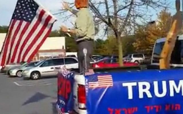 A Trump lookalike campaigns for Jewish votes in front of Baltimore's kosher supermarket, November 8, 2016 (Rebecca Shimoni Stoil) A Trump lookalike campaigns for Jewish votes in front of Baltimore's kosher supermarket, November 8, 2016 (Rebecca Shimoni Stoil)