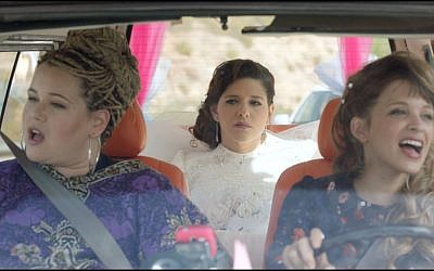 Michal, center, with her friend and sister on the way to her wedding in 'Through the Wall' (Courtesy 'Through the Wall')