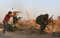 Fighters from the Free Syrian Army take part in a battle against the Islamic State group jihadists in the northern Syrian village of Yahmoul in the Marj Dabiq area north of the embattled city of Aleppo on October 10, 2016. (AFP/Nazeer al-Khatib)