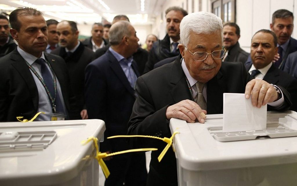 President of the Palestinian Authority Mahmoud Abbas, center, casts his vote at the Muqataa, the Palestinian Authority headquarters, in the city of Ramallah the West Bank, December 3, 2016. (AFP/Ahmad Gharabli) President of the Palestinian Authority Mahmoud Abbas, center, casts his vote at the Muqataa, the Palestinian Authority headquarters, in the city of Ramallah the West Bank, December 3, 2016. (AFP/Ahmad Gharabli)