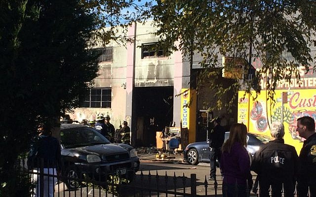 Firefighters inspect a warehouse in Oakland, California on December 3, 2016, where a fire during a rave party killed at last 9 people, as authorities warned the death toll could climb. (AFP PHOTO/Virginie GOUBIER) Firefighters inspect a warehouse in Oakland, California on December 3, 2016, where a fire during a rave party killed at last 9 people, as authorities warned the death toll could climb. (AFP PHOTO/Virginie GOUBIER)