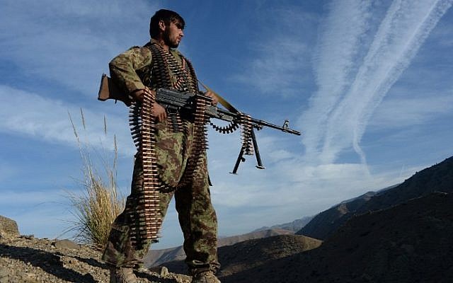 In this photograph taken on December 3, 2016, Afghan security force personnel keeps watch following an operation against Islamic State (IS) militants in Pachir Wa Agam district of Nangarhar province. (AFP PHOTO / POOL / NOORULLAH SHIRZADA) In this photograph taken on December 3, 2016, Afghan security force personnel keeps watch following an operation against Islamic State (IS) militants in Pachir Wa Agam district of Nangarhar province. (AFP PHOTO / POOL / NOORULLAH SHIRZADA)