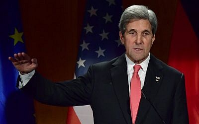 US Secretary of State John Kerry delivers his speech after being awarded by German Foreign Minister with the the Grand Cross of the Order of Merit of the Federal Republic of Germany, at the foreign ministry on December 5, 2016 in Berlin. (AFP PHOTO / John MACDOUGALL)