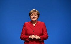 German Chancellor Angela Merkel smiles after addressing delegates during her conservative Christian Democratic Union (CDU) party's congress in Essen, western Germany, on December 6, 2016. (Tobias Schwarz/AFP)
