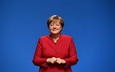 German Chancellor Angela Merkel smiles after addressing delegates during her conservative Christian Democratic Union (CDU) party's congress in Essen, western Germany, on December 6, 2016. (Tobias Schwarz/AFP)