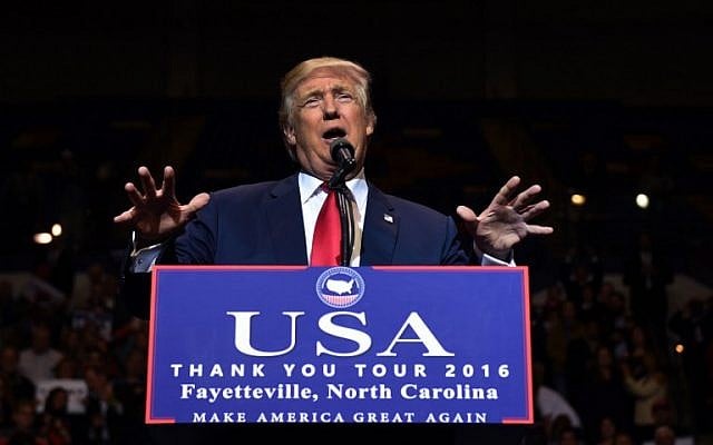 US President-elect Donald Trump speaks at the Crown Coliseum in Fayetteville, North Carolina on December 6, 2016. (AFP/TIMOTHY A. CLARY) US President-elect Donald Trump speaks at the Crown Coliseum in Fayetteville, North Carolina on December 6, 2016. (AFP/TIMOTHY A. CLARY)