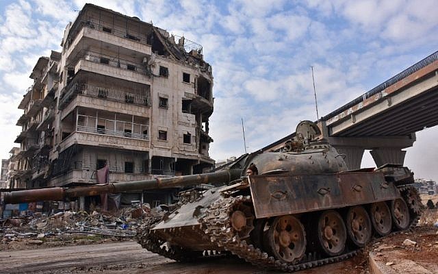 Syrian government troops patrol the newly captured al-Sakhour neighborhood in the eastern part of the northern city of Aleppo on December 7, 2016. (AFP /GEORGE OURFALIAN)