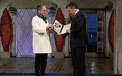 Colombian President Juan Manuel Santos receives the Nobel Peace Prize medal and diploma from Norwegian Nobel Committee member Berit Reiss-Andersen during the award ceremony in Oslo, Norway on December 10, 2016. (AFP/NTB SCANPIX/Haakon Mosvold Larsen)