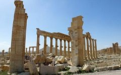 A view of the remains of Arch of Triumph, also called the Monumental Arch of Palmyra, that was destroyed by Islamic State (IS) group jihadists seen here on March 27, 2016. (AFP/Maher AL MOUNES)