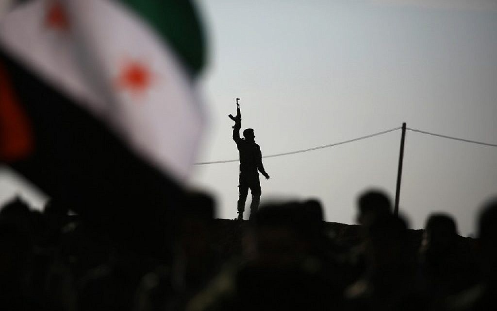 Fighters from the Kurdish-Arab alliance, known as the Syrian Democratic Forces, prepare for an assault on the Islamic State bastion of Raqqa near the village of Aliyah on the outskirts of the jihadi stronghold on December 10, 2016. (AFP/DELIL SOULEIMAN)