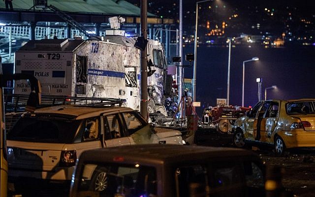 Damaged police vehicles and cars are pictured on December 10, 2016 on the site where a car bomb exploded near the stadium of football club Besiktas in central Istanbul. (AFP PHOTO / OZAN KOSE) Damaged police vehicles and cars are pictured on December 10, 2016 on the site where a car bomb exploded near the stadium of football club Besiktas in central Istanbul. (AFP PHOTO / OZAN KOSE)