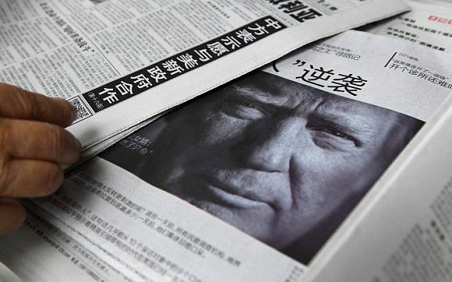 This photo taken on November 10, 2016, shows a newspaper featuring a photo of US President-elect Donald Trump at a newsstand in Beijing. (AFP/Greg Baker) This photo taken on November 10, 2016, shows a newspaper featuring a photo of US President-elect Donald Trump at a newsstand in Beijing. (AFP/Greg Baker)