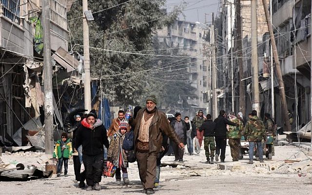 Syrian residents flee violence in Aleppo's eastern al-Salihin neighborhood on December 12, 2016 after regime troops retook the area from rebel fighters (AFP PHOTO / GEORGE OURFALIAN) Syrian residents flee violence in Aleppo's eastern al-Salihin neighborhood on December 12, 2016 after regime troops retook the area from rebel fighters (AFP PHOTO / GEORGE OURFALIAN)