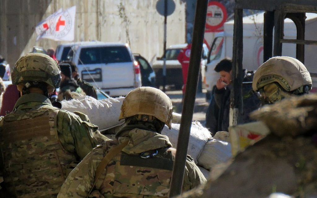 Illustrative: Russian soldiers gather in the government held side of the embattled city of Aleppo before the start on an evacuation operation of rebel fighters and their families from rebel-held areas on December 15, 2016. (AFP Photo/Stringer) Illustrative: Russian soldiers gather in the government held side of the embattled city of Aleppo before the start on an evacuation operation of rebel fighters and their families from rebel-held areas on December 15, 2016. (AFP Photo/Stringer)