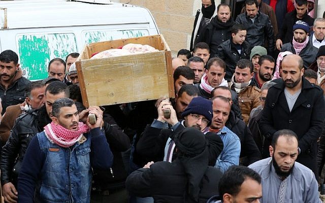 Jordanian mourners carry the coffin of a victim of an attack at the funeral on December 19, 2016 in Karak, a tourist destination known for one of the region's biggest Crusader castles, around 120 kilometers (70 miles) south of the capital Amman. ( AFP PHOTO / Khalil MAZRAAWI)