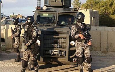 Illustrative: Jordanian security forces are seen on December 19, 2016, during the funeral of victims who were killed a day earlier in an attack in Karak, a tourist destination. (Khalil Mazraawi/AFP)
