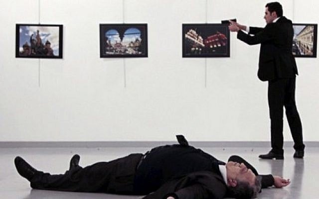 Andrei Karlov (bottom), the Russian ambassador to Ankara, lying on the floor, after being shot by Mevlut Mert Altintas (R), during an attack at a public event in Ankara, December 19, 2016. (AFP/Hurriyet/Hasim KILIC/Turkey Out) Andrei Karlov (bottom), the Russian ambassador to Ankara, lying on the floor, after being shot by Mevlut Mert Altintas (R), during an attack at a public event in Ankara, December 19, 2016. (AFP/Hurriyet/Hasim KILIC/Turkey Out)