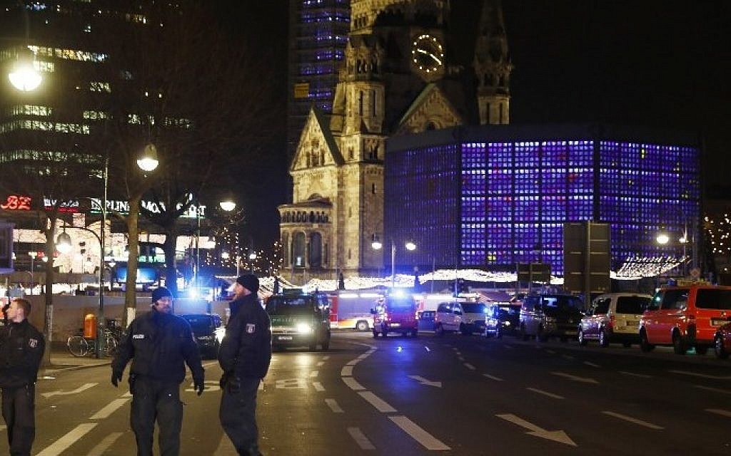 Police blocks a road leading to a scene next to the Gedächniskirche church where a truck crashed into a Christmas market in Berlin, on December 19, 2016 killing at least nine people and injuring at least 50 people. (AFP PHOTO / Odd ANDERSEN)