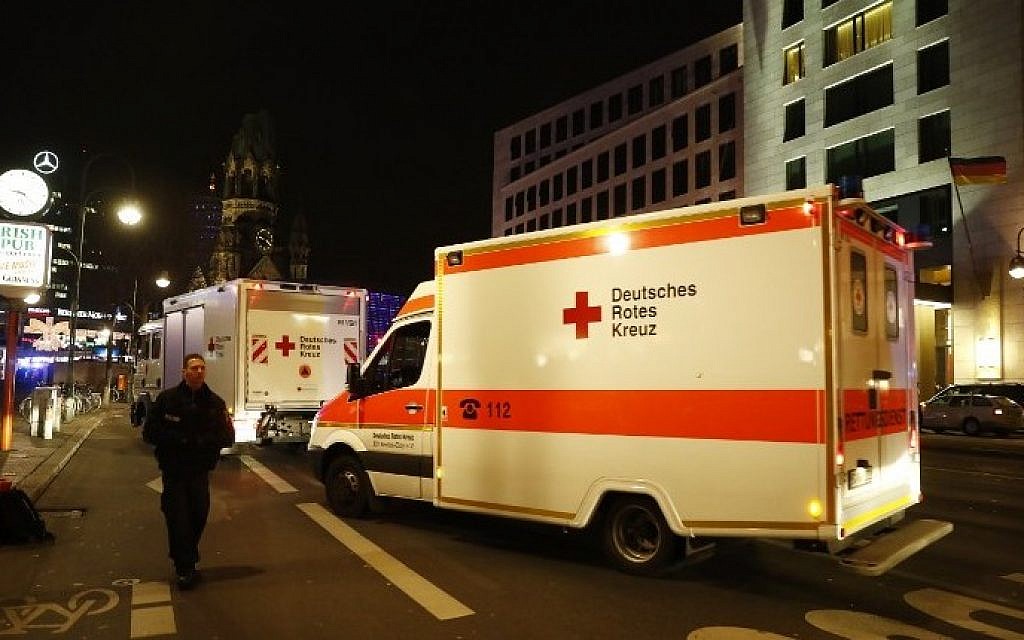 Ambulances arrive on a road leading to a scene next to the Gedächniskirche church where a truck crashed into a Christmas market in Berlin, on December 19, 2016 killing at least nine people and injuring at least 50 people. (AFP PHOTO / Odd ANDERSEN)