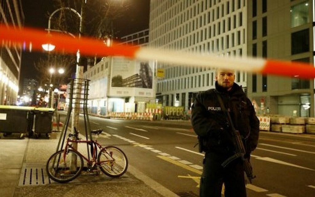 Police block the road leading to the site next to the Gedächniskirche church where a truck crashed into a Christmas market in Berlin, on December 19, 2016 killing at least nine people and injuring at least 50 people. (AFP PHOTO / Odd ANDERSEN)