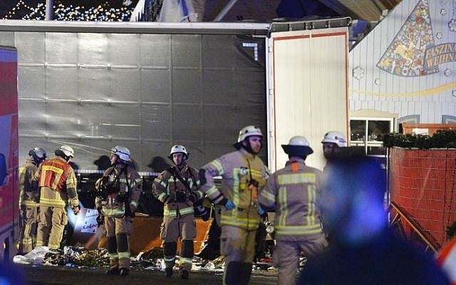 Medics and firefighters work at the scene where a truck crashed into a Christmas market at Gedächniskirche church in Berlin, on December 19, 2016 killing at least nine people and injuring at least 50. (AFP Photo/Odd Andersen) Medics and firefighters work at the scene where a truck crashed into a Christmas market at Gedächniskirche church in Berlin, on December 19, 2016 killing at least nine people and injuring at least 50. (AFP Photo/Odd Andersen)
