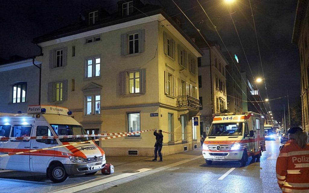 Ambulance and police cars are seen outside a Muslim prayer hall, central Zurich, on December 19, 2016, after three people were injured by gunfire. 
(AFP PHOTO / Michael Buholzer)