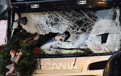The broken wind shield of a truck that crashed into a Christmas market near the (Kaiser Wilhelm Memorial Church in Berlin is pictured on December 20, 2016. (AFP Photo/Tobias Schwarz)