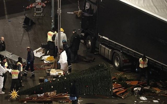 Forensic police officers work on December 20, 2016 at the scene where a truck rammed into a Christmas market near the Kaiser Wilhelm Memorial Church in Berlin, killing at least 12 people. (Odd Andersen/AFP) Forensic police officers work on December 20, 2016 at the scene where a truck rammed into a Christmas market near the Kaiser Wilhelm Memorial Church in Berlin, killing at least 12 people. (Odd Andersen/AFP)