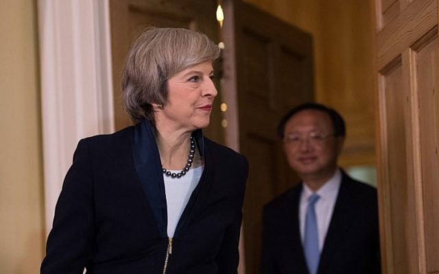 British Prime Minister Theresa May (L) enters the room followed by Chinese State Councillor Yang Jiechi (R) at the start of a meeting at 10 Downing Street in London on December 20, 2016. (AFP PHOTO / POOL / Carl Court) British Prime Minister Theresa May (L) enters the room followed by Chinese State Councillor Yang Jiechi (R) at the start of a meeting at 10 Downing Street in London on December 20, 2016. (AFP PHOTO / POOL / Carl Court)