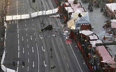 View of the area of the Christmas market area and the destroyed booths targeted by an attack with a truck two days ago in front of the Kaiser Wilhelm Memorial Church in Berlin on December 21, 2016. (AFP Photo/Odd Andersen)