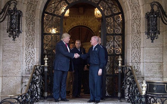 US President-elect Donald Trump, left, shakes hands with military brass following meetings at Mar-a-Lago in Palm Beach, Florida, on December 21, 2016. (Jim Watson/AFP)