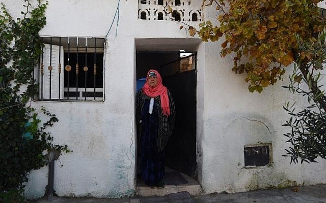 Nour-Houda Amri, the mother of 24-year-old Anis Amri, the prime suspect in Berlin's deadly truck attack, is seen in front her house in the town of Oueslatia, in Tunisia's region of Kairouan on December 22, 2016. (AFP PHOTO/FETHI BELAID)