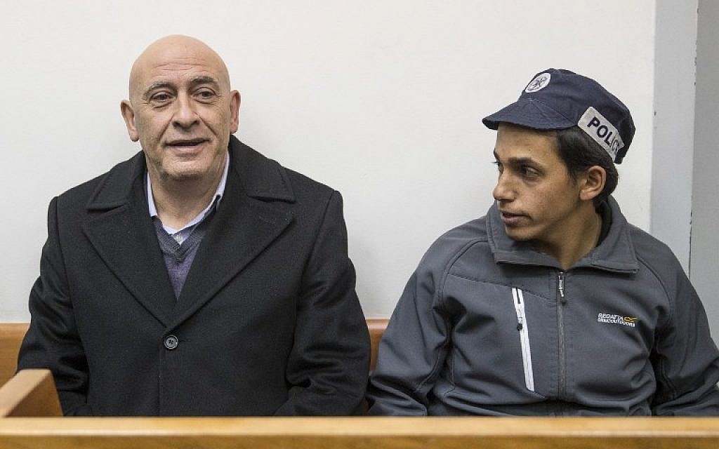 Arab MK Basel Ghattas attends a remand hearing at Rishon Lezion Magistrate's Court on December 23, 2016, a day after he was arrested for allegedly passing cell phones to convicted terrorists jailed in Israel. (AFP/Jack Guez)