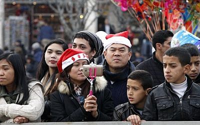 Palestinians and tourists attend a performance at Manger Square outside the Church of the Nativity during Christmas celebrations in the West Bank city of Bethlehem on December 24, 2016. (AFP Photo/Hazem Bader)