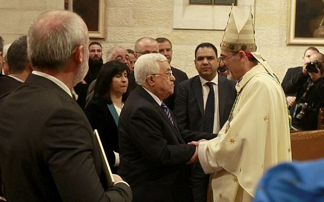 Palestinian President Mahmoud Abbas and Archbishop Pierbattista Pizzaballa (R), apostolic administrator of the Latin Patriarch of Jerusalem, during the Christmas Midnight Mass on December 25, 2016 in Bethlehem, West Bank. (AFP Photo/AFP Pnoto and Pool/ Musa al Shaer) Palestinian President Mahmoud Abbas and Archbishop Pierbattista Pizzaballa (R), apostolic administrator of the Latin Patriarch of Jerusalem, during the Christmas Midnight Mass on December 25, 2016 in Bethlehem, West Bank. (AFP/ Musa al Shaerd/Pool)