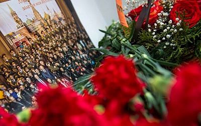 A picture and flowers are seen at the home stage building of the Alexandrov Ensemble (The Red Army Choir), in Moscow on December 25, 2016. (AFP Photo/ Alexander Utkin)