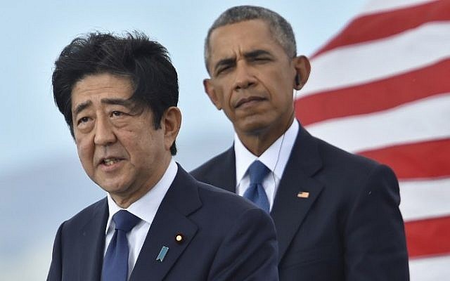 US President Barack Obama (R) listens as Japanese Prime Minister Shinzo Abe speaks at the USS Arizona Memorial on December 27, 2016 at Pearl Harbor in Honolulu, Hawaii. (AFP PHOTO / Nicholas Kamm) US President Barack Obama (R) listens as Japanese Prime Minister Shinzo Abe speaks at the USS Arizona Memorial on December 27, 2016 at Pearl Harbor in Honolulu, Hawaii. (AFP PHOTO / Nicholas Kamm)