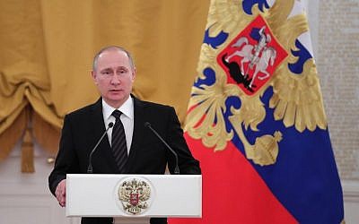 Russian President Vladimir Putin delivers a speech during a reception dedicated to the celebration of the New Year at the Kremlin in Moscow on December 28, 2016. (AFP PHOTO / Sputnik / Michael Klimentyev)