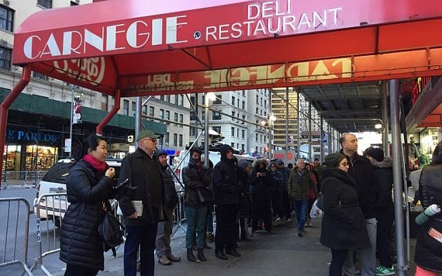 People line up to get into the Carnegie Deli December 30, 2016 in New York. The deli will close after 79 years of service on December 30. (AFP/Catherine Triomphe) People line up to get into the Carnegie Deli December 30, 2016 in New York. The deli will close after 79 years of service on December 30. (AFP/Catherine Triomphe)