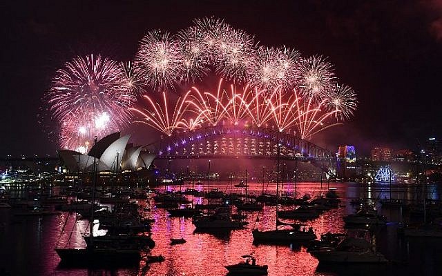 New Year's fireworks illuminate the sky over the iconic Opera House and Harbor Bridge in Sydney, Australia on January 1, 2017. (AFP/Saeed Khan) New Year's fireworks illuminate the sky over the iconic Opera House and Harbor Bridge in Sydney, Australia on January 1, 2017. (AFP/Saeed Khan)