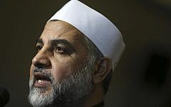 Imam Mohammad Qatanani answers a question as he joins a group of Muslim community leaders gathered in Piscataway, NJ to condemn terrorist attacks, on Nov. 17, 2015. (AP Photo/Mel Evans,file)