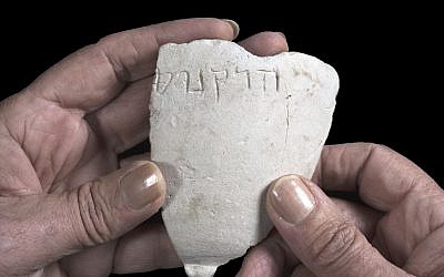Fragment of a chalk bowl from the Hasmonean period, on which the name Hyrcanus appears. (Clara Amit, Israel Antiquities Authority)